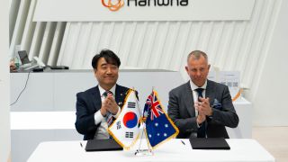 Contract signing with Hichang Lee (left), HDA’s Director Facilities and Gareth Evans, Managing Director of Rohde & Schwarz Australia. (Image: Rohde & Schwarz)